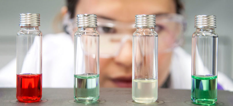 Scientist checking coloured samples